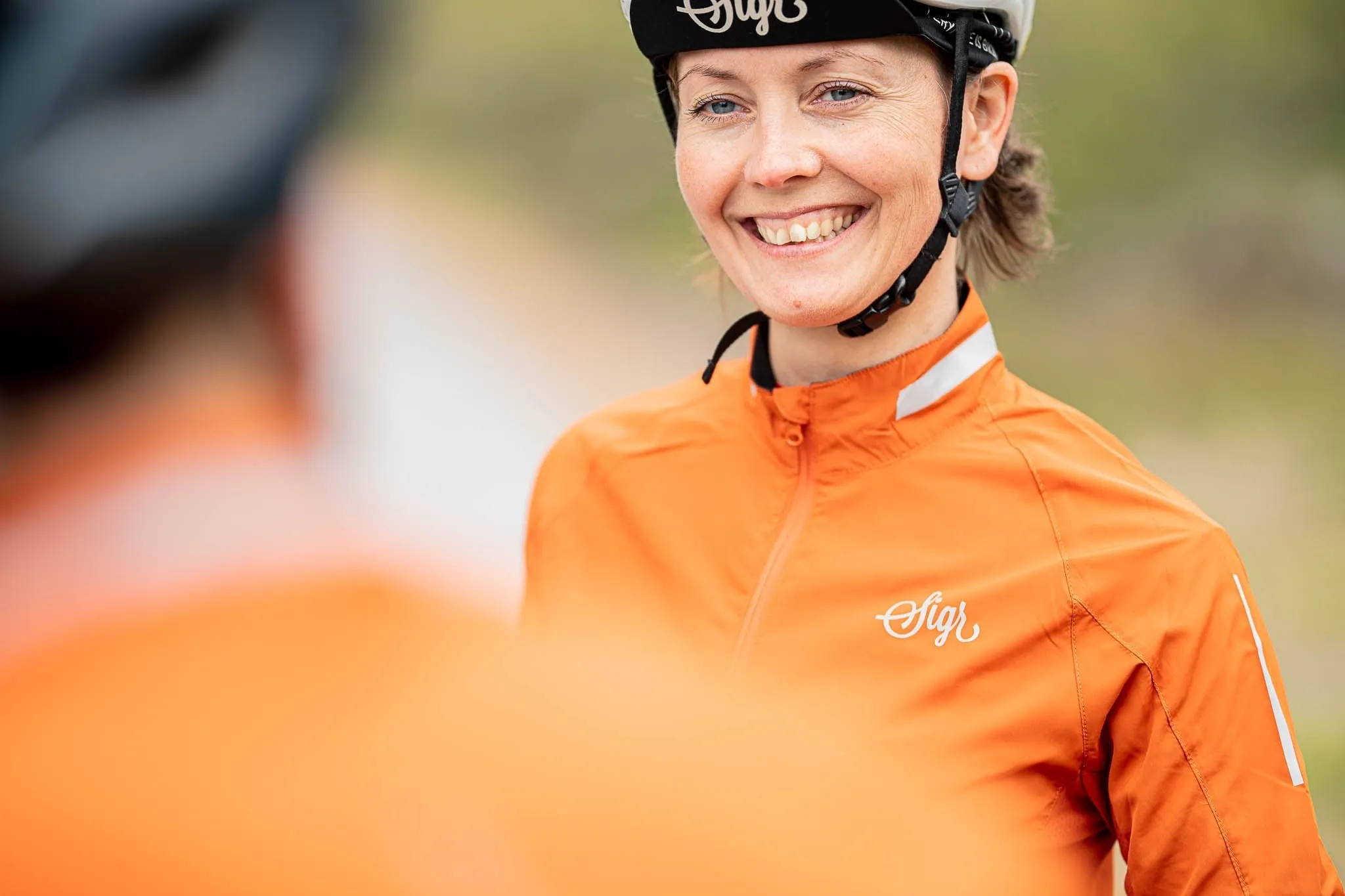 Treriksröset Orange Women's Cycling Wind/Pack Jacket